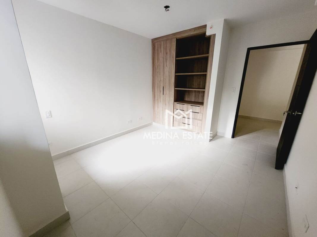 Kitchen with granite countertops, double sink, wood cabinets and appliances at Embassy Village Clayton