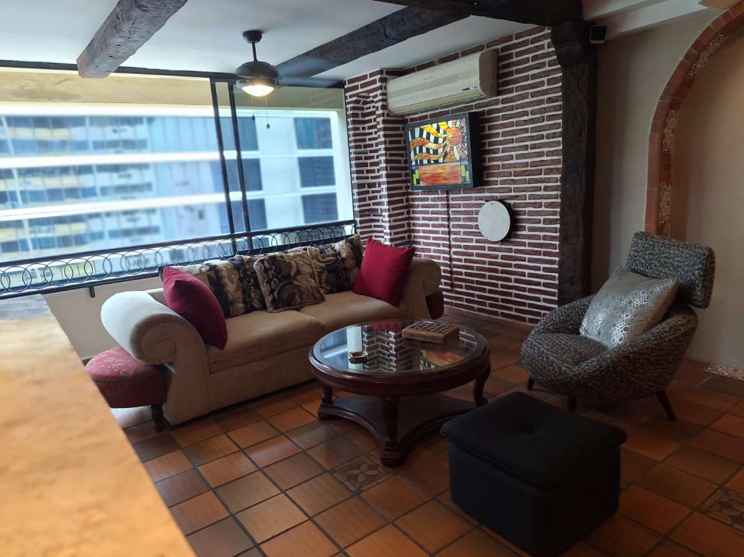 Balcony kitchenette area with granite counter, glass block bar, city view Obarrio Panama City