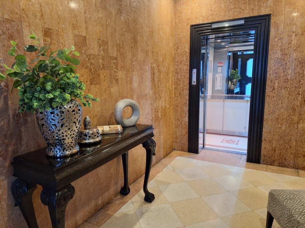 Traditional foyer with mosaic tile, framed art, decorative sconces in PH Terrazas Obarrio