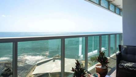 Designer kitchen with granite countertops and teca cabinets in PH Ocean Waves Nueva Gorgona Panama