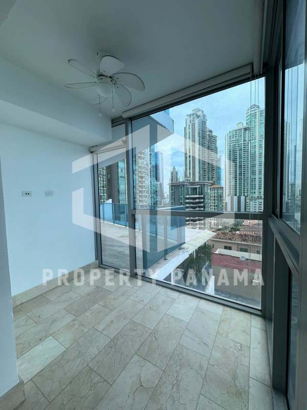 Modern walk-in closet with built-in cabinetry, wood finish and recessed lighting in PH Grand Tower Panama