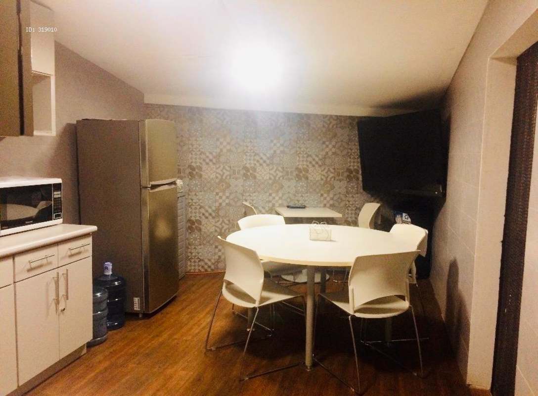 Staircase with metal handrails barred window and open gates in commercial duplex Obarrio Panama