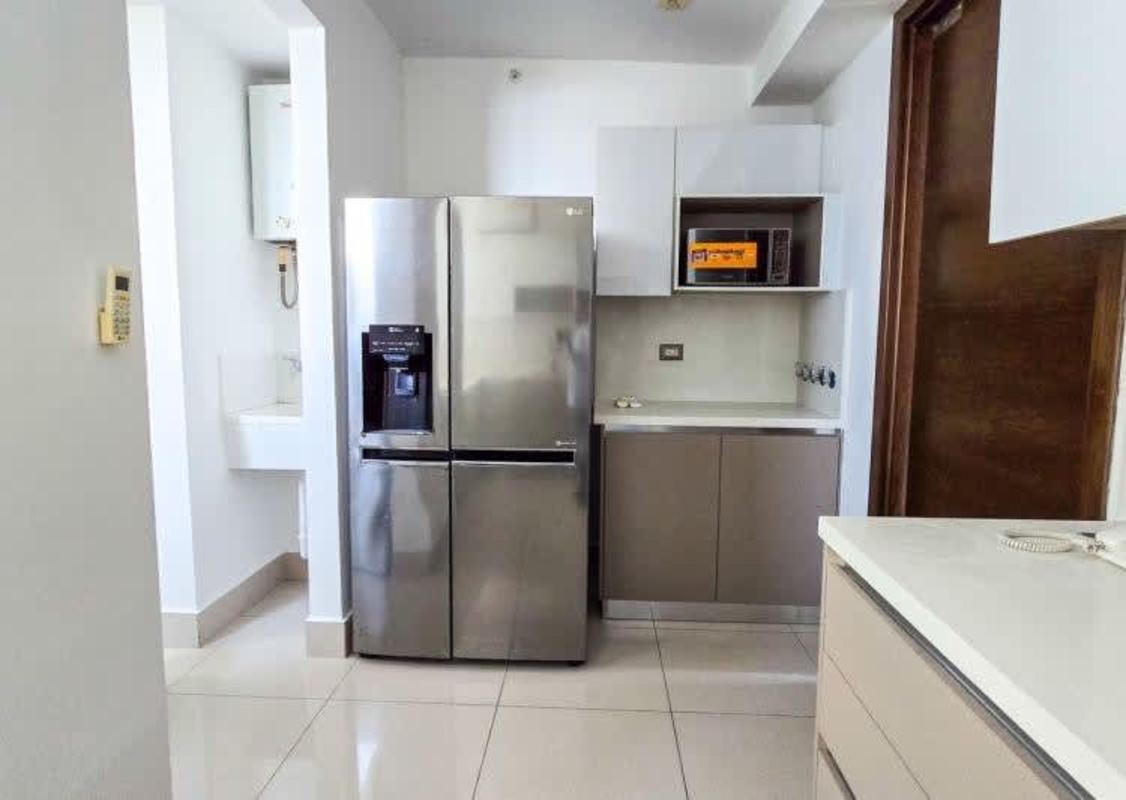 Bright kitchen space with fridge, microwave PH Costa del Mar Costa del Este