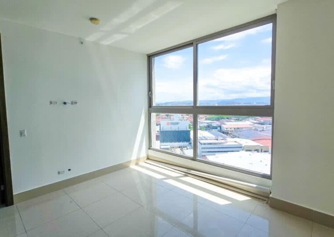 Bedroom with large window and ceramic floors Costa del Este Panama apartment