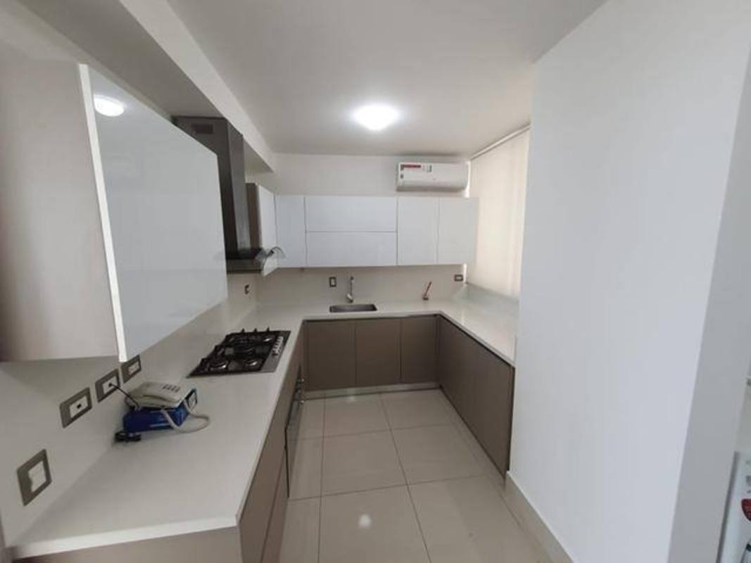 U-shaped kitchen with granite countertops and stainless appliances in PH Costa del Mar Costa del Este Panama