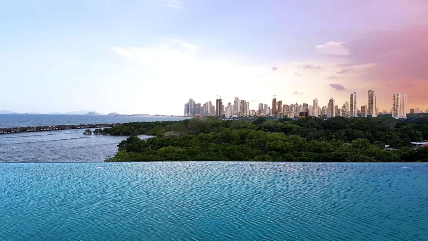 Infinity pool with ocean and city skyline in PH Costa del Mar Panama
