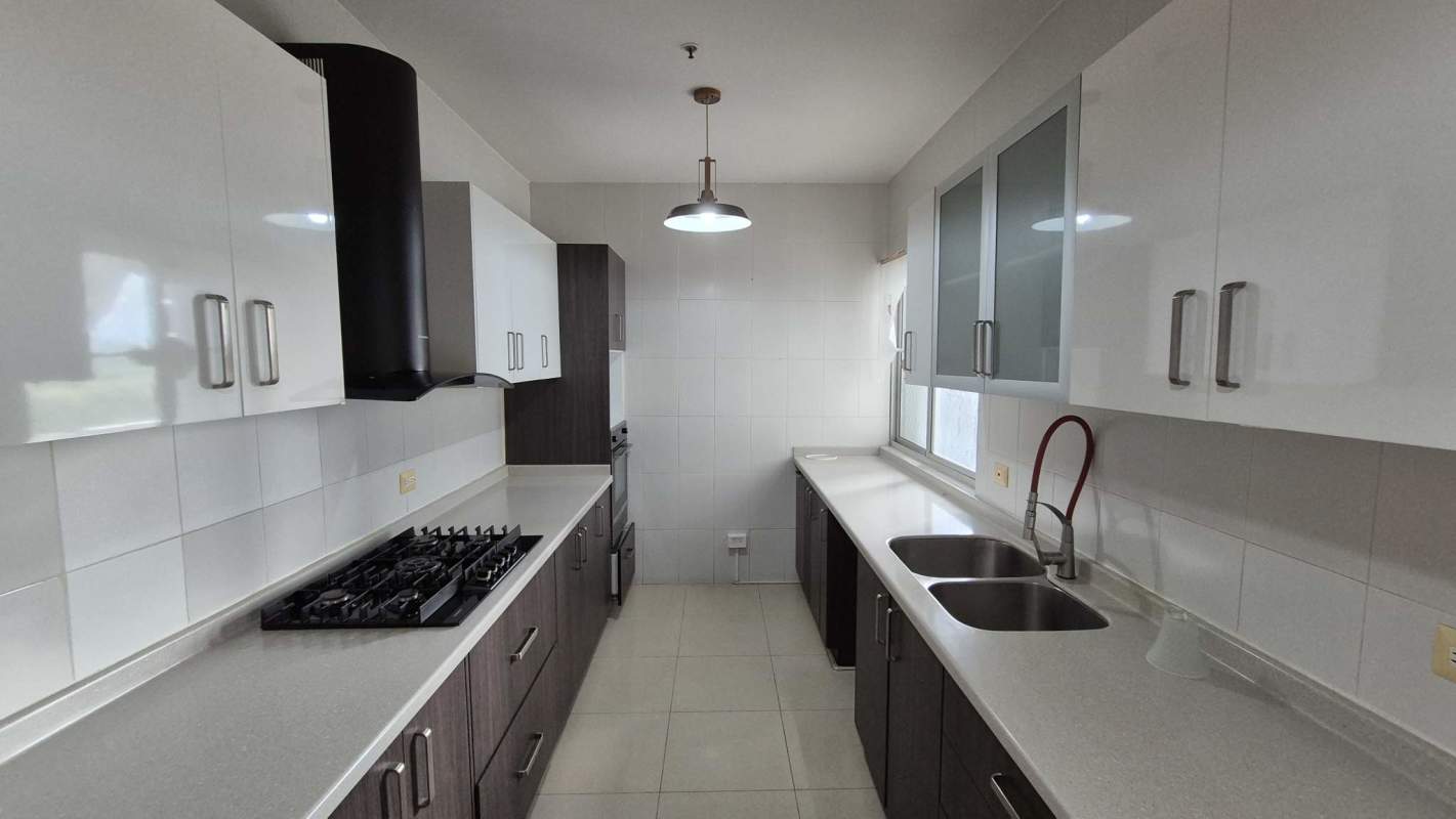 Modern bathroom with glass shower, granite countertop, large mirror in PH Window Tower San Francisco