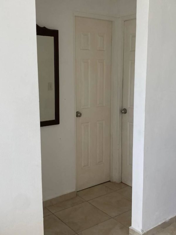 Interior hallway with white panel doors and mirror in PH Mystic Blue Juan Díaz Panama