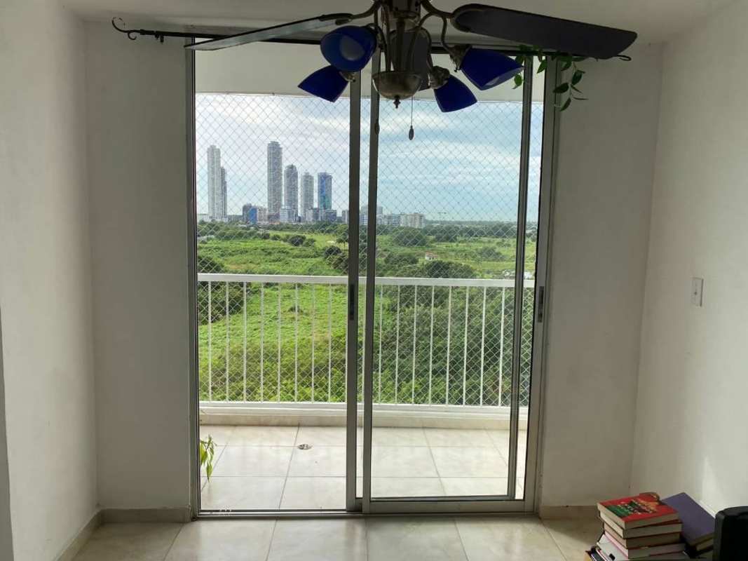 Bright bedroom with window, curtains, minimalistic decor in PH Mystic Blue Juan Díaz Panama