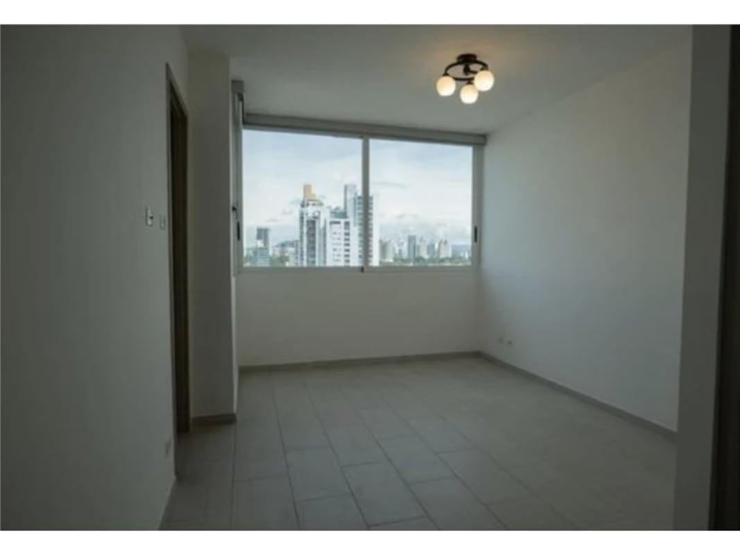 Spacious living room with panoramic windows and skyline view PH The Towers Panama