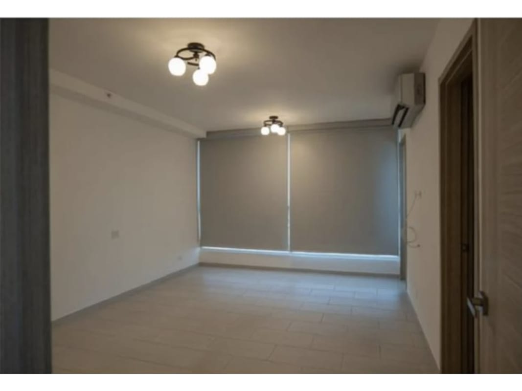 Modern kitchen in PH The Towers with granite countertops, double sink, appliances, light gray cabinetry