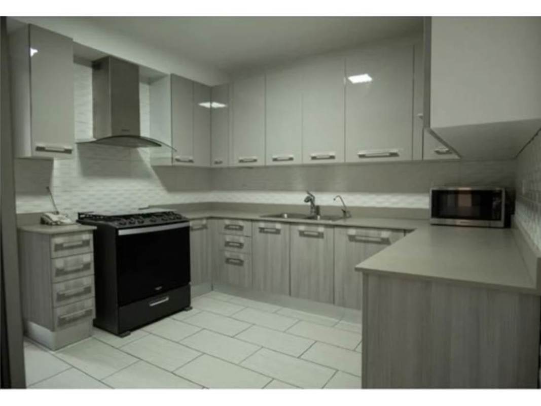 Open-concept kitchen and dining space with granite counters PH The Towers Panama