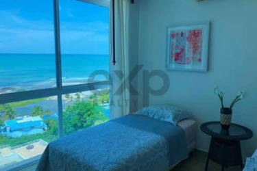 Bright bedroom with panoramic ocean view window at PH Terrazas de Farallón Playa Blanca Panama