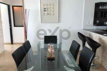 Luxury bathroom with jacuzzi, stone tile, glass shower and twin sinks at Playa Blanca condo