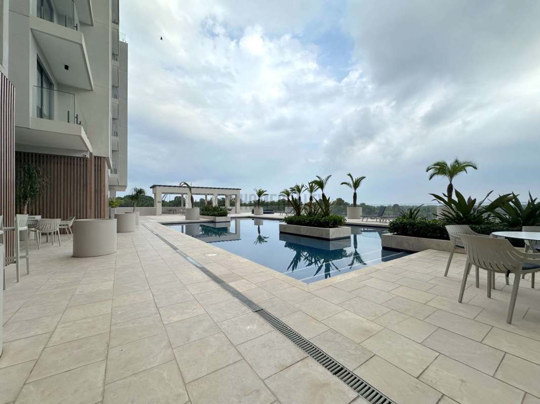 Upscale rooftop swimming pool deck Santa Maria Golf Panama apartment rental amenities