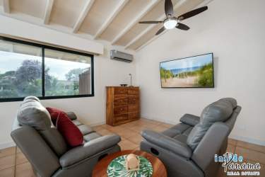 Spacious bedroom with vaulted ceiling, natural light and garden views at Coronado Luxury Suites Panama