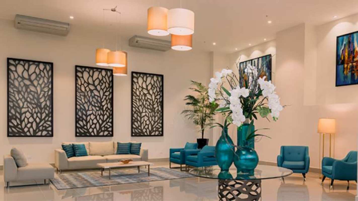 Bright living room dining area with city view balcony, large windows in PH Lefevre 75 Panama City