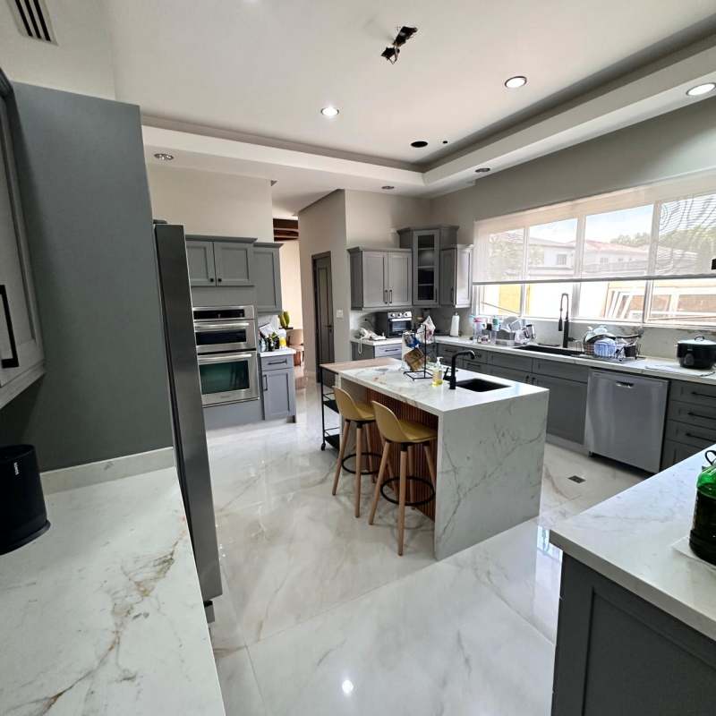 Elegant dining area marble floors chandelier luxury house Villas del Mar Costa del Este Panama
