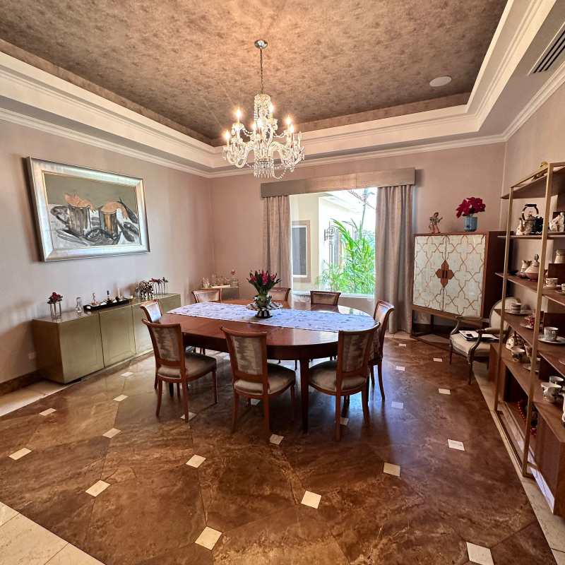 Curved marble staircase and elegant entry hall with chandelier luxury house Villas del Mar Costa del Este Panama