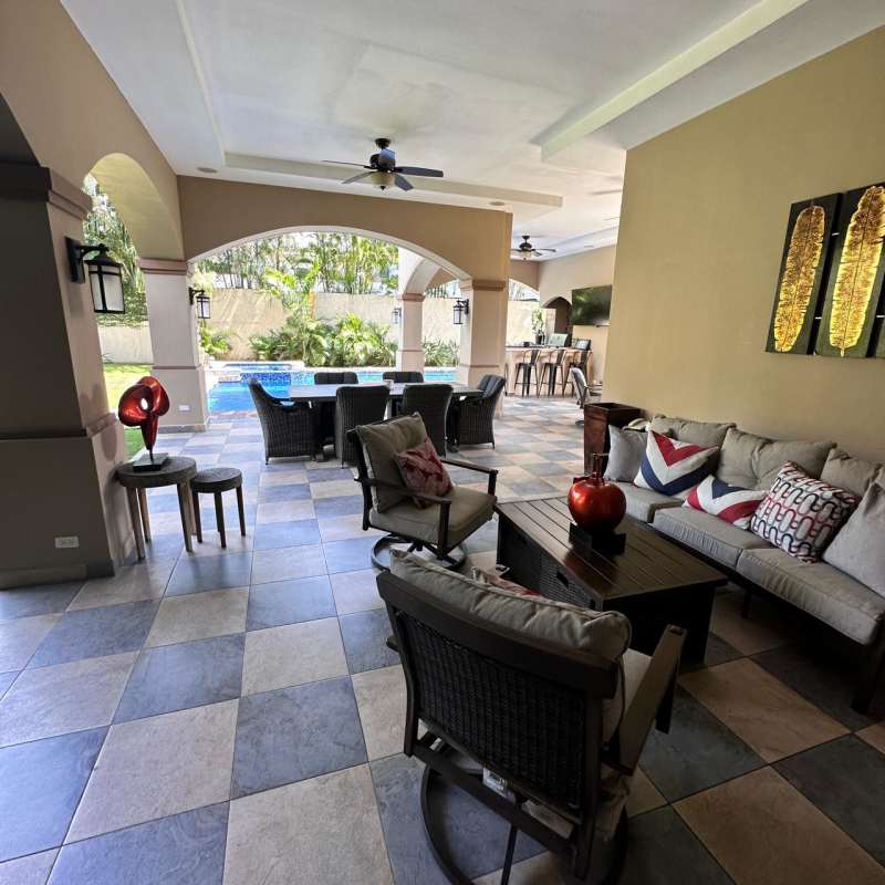 Outdoor kitchen and BBQ grill area by pool luxury villa Costa del Este Panama