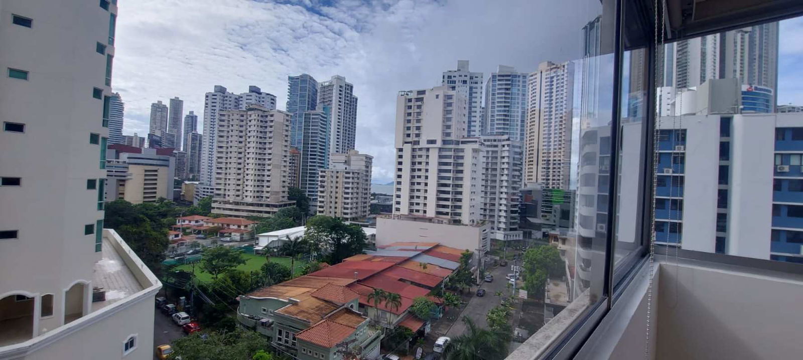 Urban apartment balcony with security bars view of Panama City skyline PH La Concha Marbella