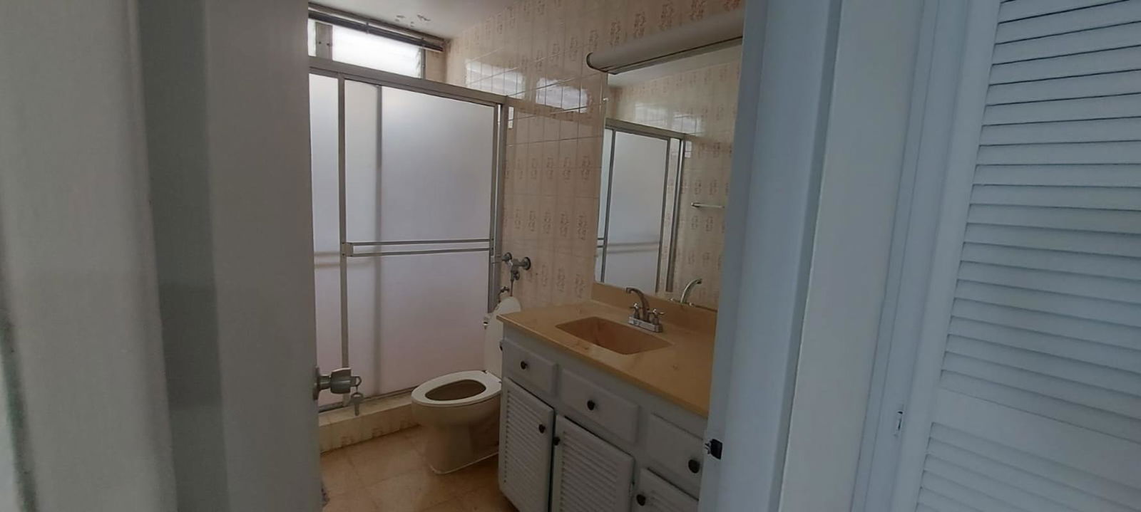 Bedroom with large white louvered closets minimalist design PH La Concha Marbella