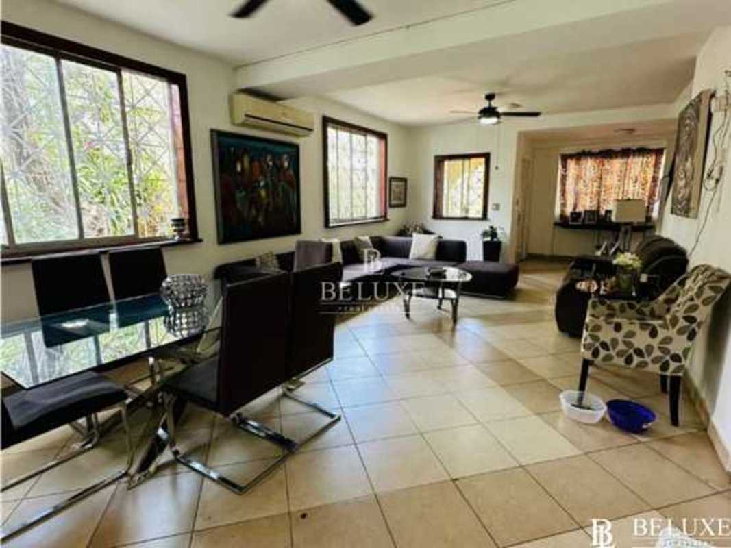 Bright open living dining room with large windows, tile floors in Balboa Ancón Panama City