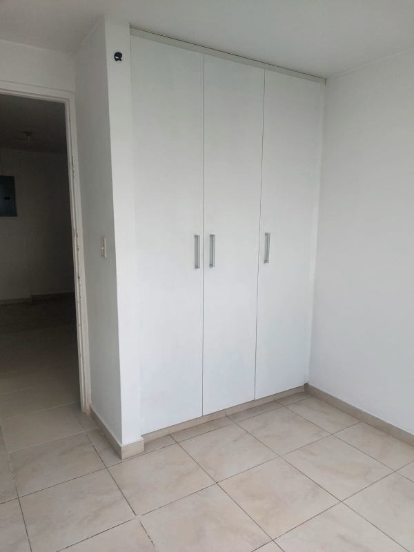Bedroom with tile flooring, large window, natural light, PH Residencial Llano Bonito Panama