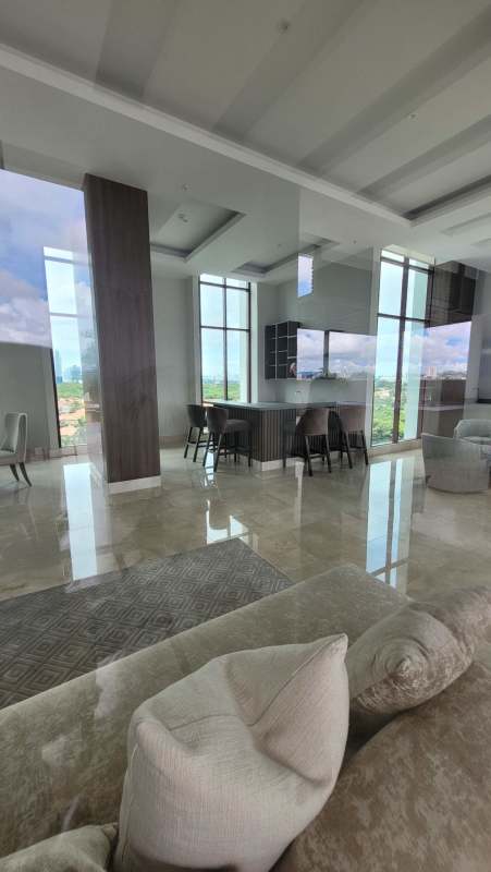 Spacious luxury lobby with marble and wood finishes at PH The Colonial Santa Maria