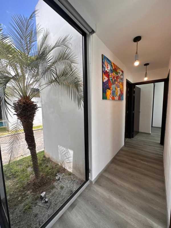 Modern open kitchen with granite top and backsplash in beach villa Bijao Panama