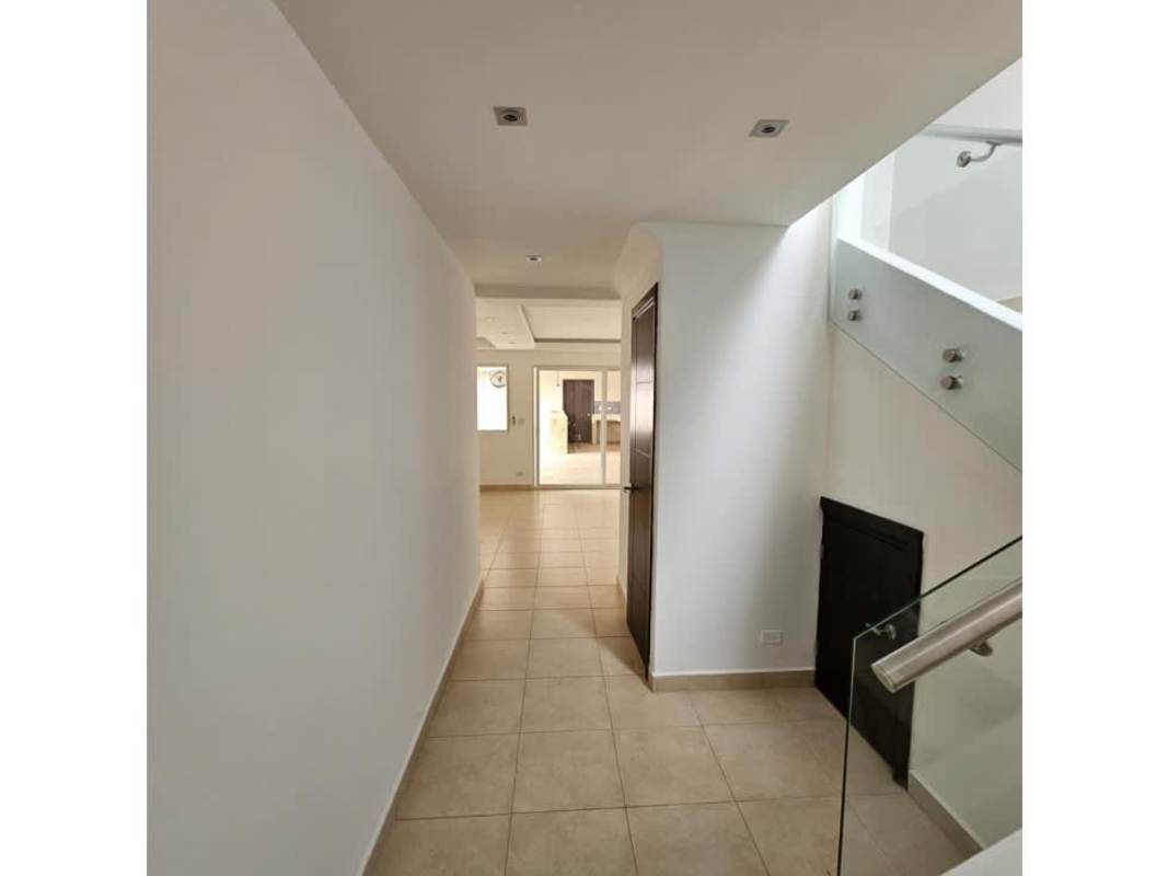 Bright large living room with ceramic floors, ceiling fan, modern lighting in Villa Navona Brisas del Golf