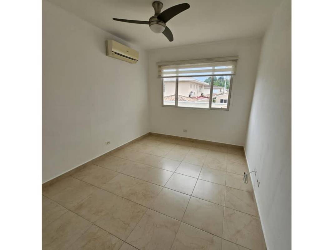 Comfortable bedroom with tile flooring, ceiling fan, closet and window Villa Navona Panama