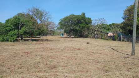 Flat clear highway-adjacent land plot with utilities near Penonomé Panama for commercial use