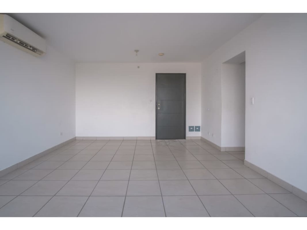 Modern minimalist living room with tiled floors and AC at Lefevre 75 apartment Panama