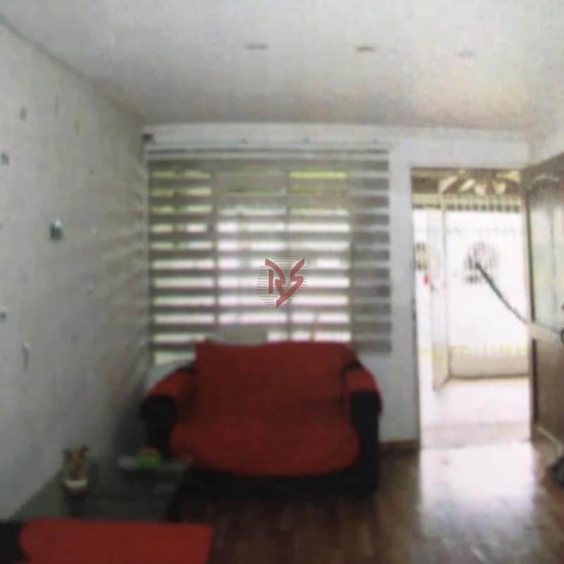 Living area with wood flooring, accent wall, furniture in Nueva Concepción Juan Díaz