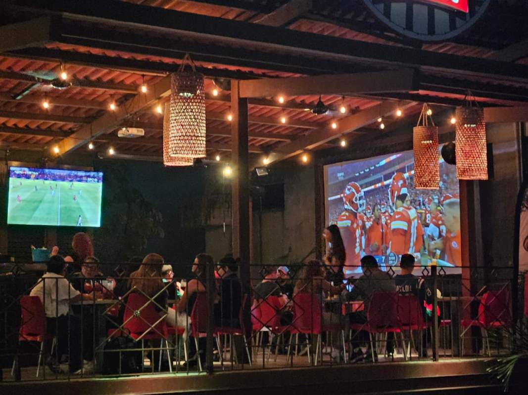 Karaoke lounge with tufted black seating and neon lighting for sale in commercial bar Panama City