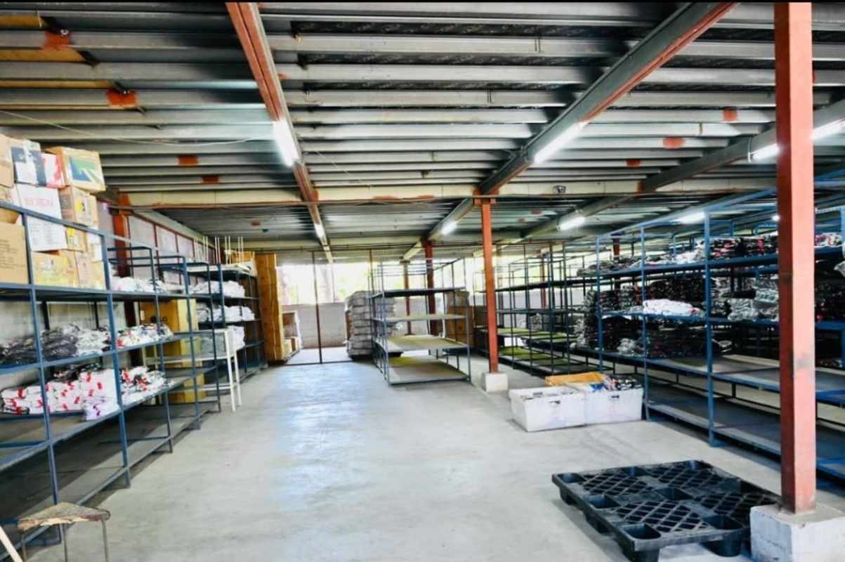 Interior warehouse space with shelving units and concrete floor for storage Panama