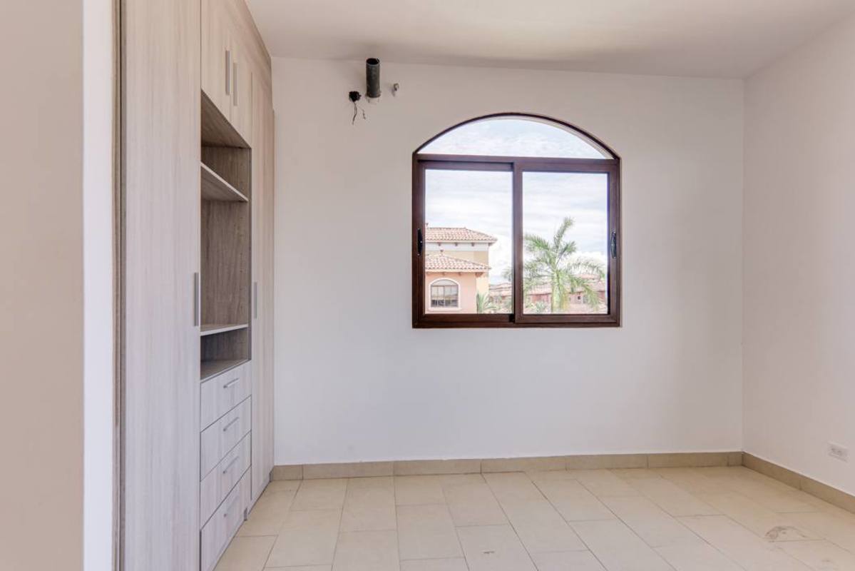 Modern bathroom with freestanding tub and large bay window at Costa Sur Panama house