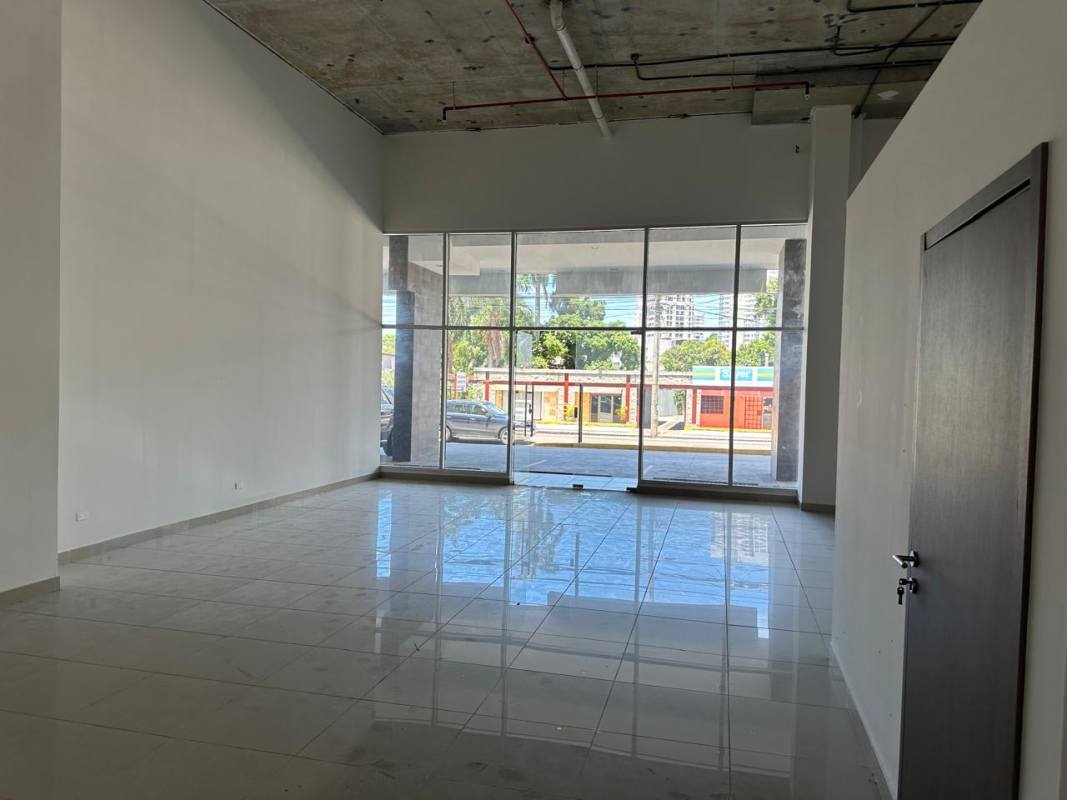 Wide modern retail storefront with ample glass facade on busy avenue Panama City 12 de Octubre
