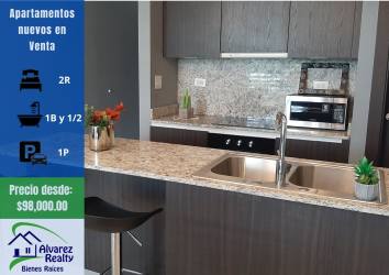Living room with gray sofa, marble table, large window in new PH Boquete Gardens apartment David