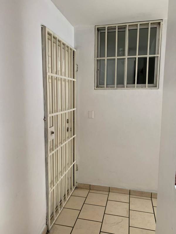 Small apartment balcony with railing and city views in PH Altos de la Colina Pueblo Nuevo Panama