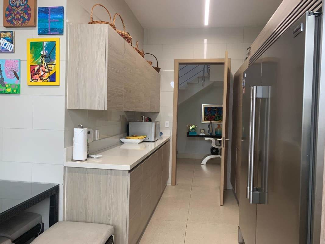 Master bedroom with large windows overlooking garden luxury house The Grove Santa María Panama City