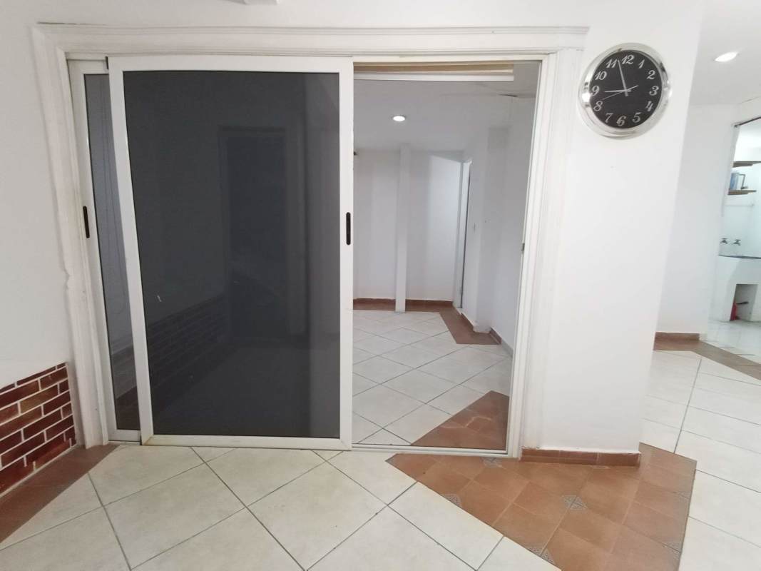 Dining area with ceiling fans and patio doors family house Panama