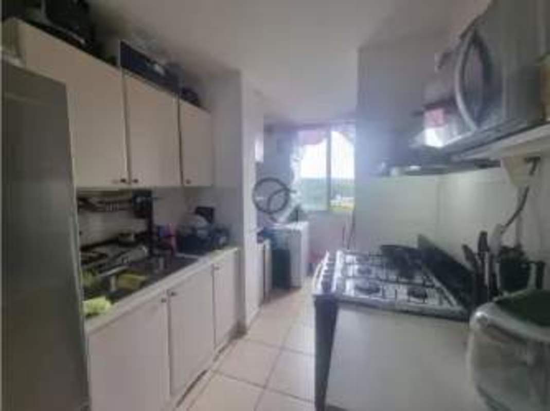 Equipped kitchen with laundry area in PH Vista Esmeralda Betania Panama City