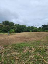 Open parcel of land surrounded by greenery close to beach and river San Carlos Panama