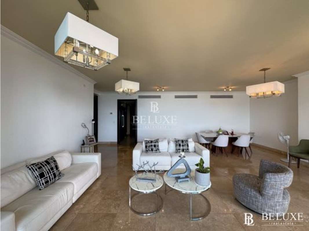 Bright bedroom with large windows overlooking Pacific Ocean, walk-in closet, marble floors at PH Q Tower