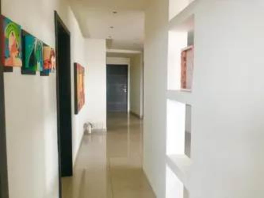 Modern hallway with recess lighting, decorative niche, tile floors in PH Joy Tower Coco del Mar Panama
