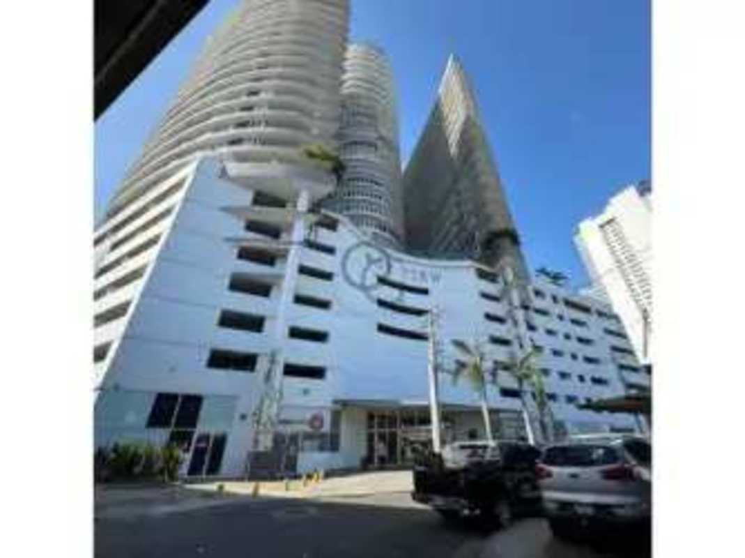 Exterior of Bay View Tower with curved balconies and panoramic city ocean views in Panama City