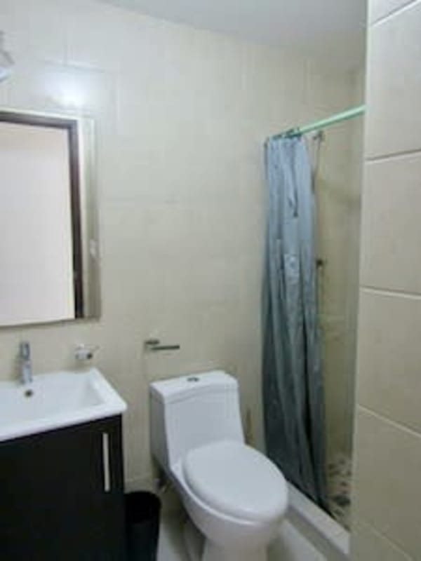 Open living and dining area with large window ocean views in PH Bayview Panama