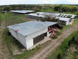 Aerial farmland view with multiple barns and storage buildings on 120,000m2 in Jagüito Antón Coclé Panama